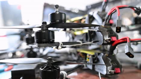a detailed shot of homemade drones being prepared for combat in ukraine. this innovative, low-cost weaponry showcases the future of asymmetric conflict and rapid production