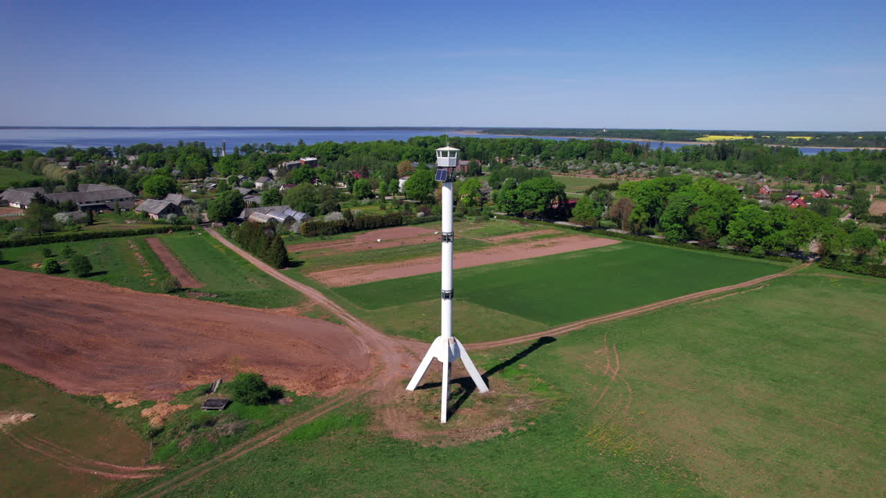 Orbital shot of watchtower shaped like a rocket in Burtnieku, Latvia