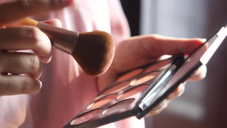 woman applying makeup