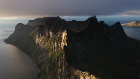 dramatic cliffs dropping into the sea in the arctic norwegian sea