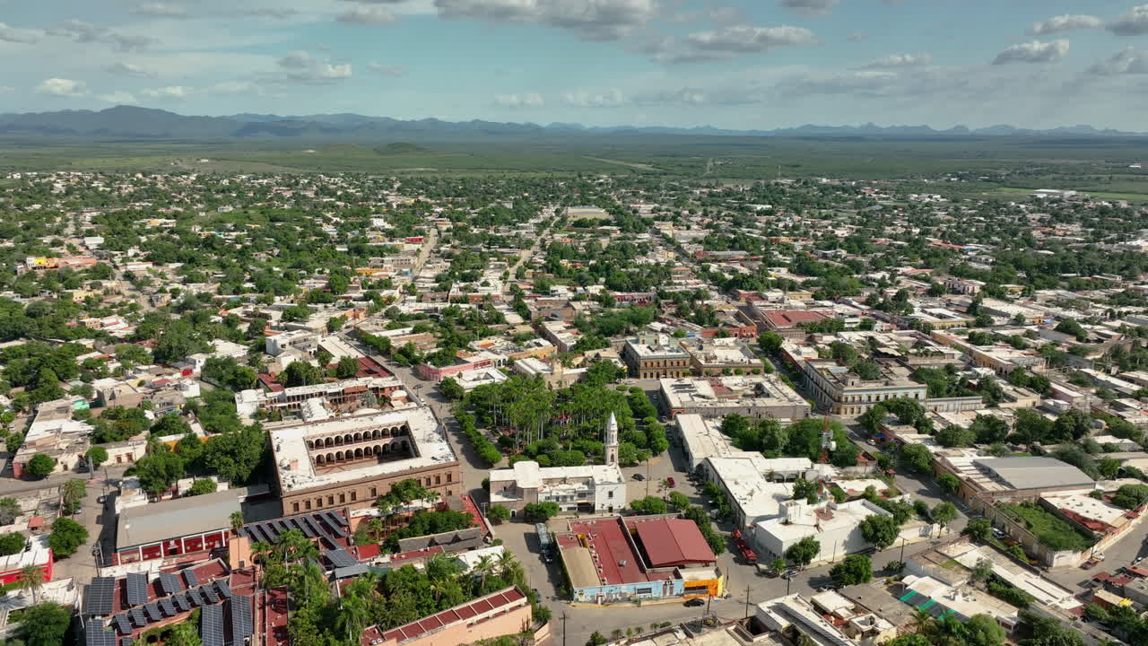 Panoramic drone shot circling over downtown El Fuerte, in sunny Sinaloa, Mexico