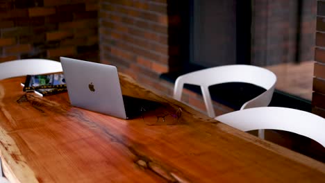 modern workspace with laptop and books