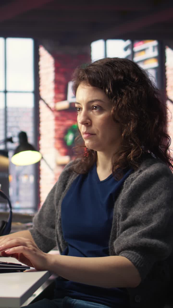 Vertical Video Software expert at workstation programming on pc and writing lines of code