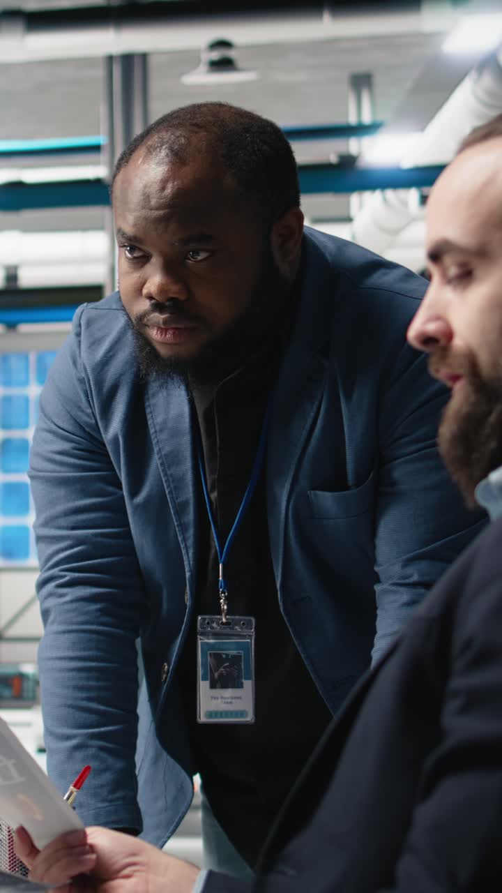 Vertical Video Factory supervisors diverse team sharing insight about production metrics