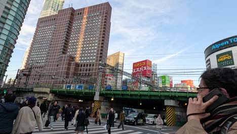 pedestrians crossing busy urban intersection