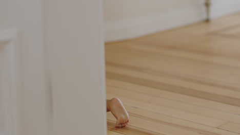 happy baby girl crawling on floor toddler exploring home curious infant having fun enjoying childhood