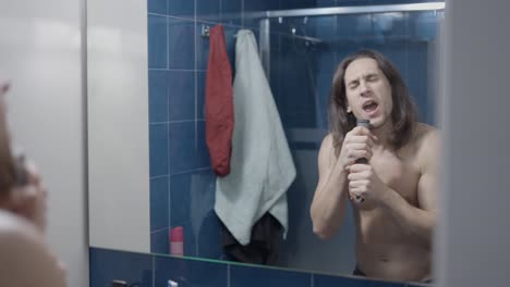 man singing in the bathroom