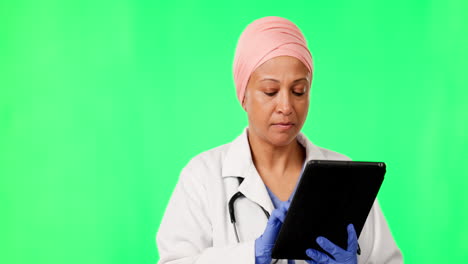 Doctor,-woman-and-tablet-by-green-screen