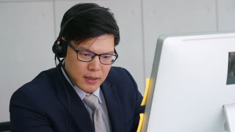 business people wearing headset working in office