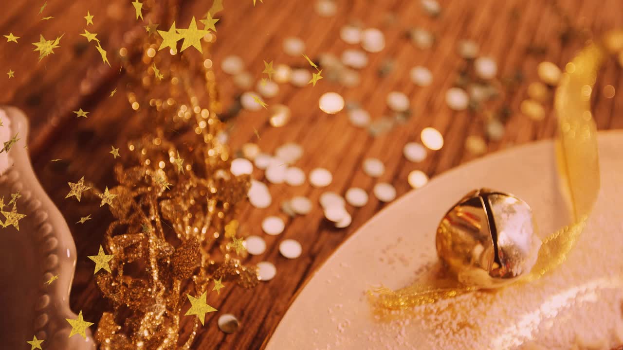 Golden star confetti drifting left and camera panning revealing sugar dusted bell and bundt cakes