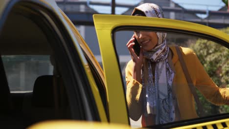 young woman wearing hijab out and about in the city