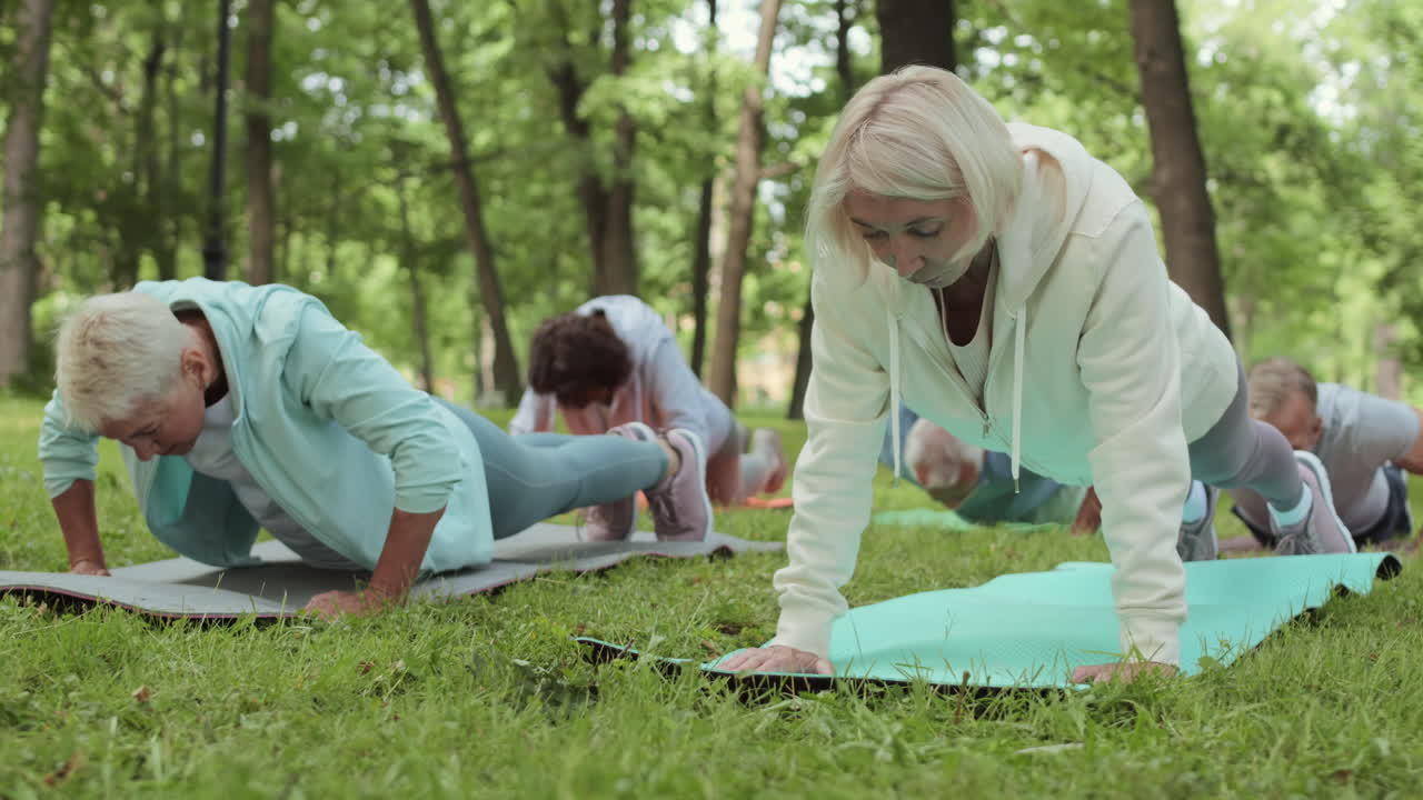 Seniors doing push-ups outdoors