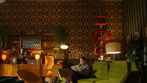 woman reading in a retro living room