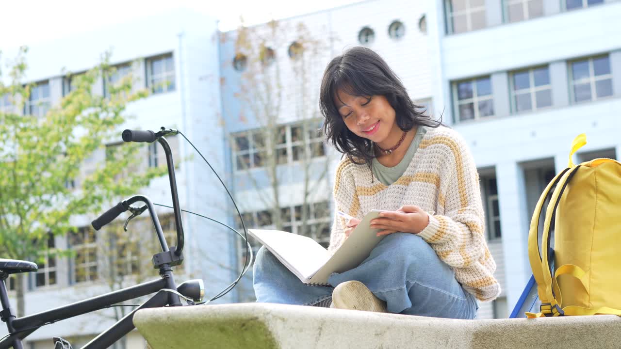 Student Studying Outdoors on Campus