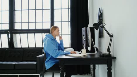 woman working on computer at home