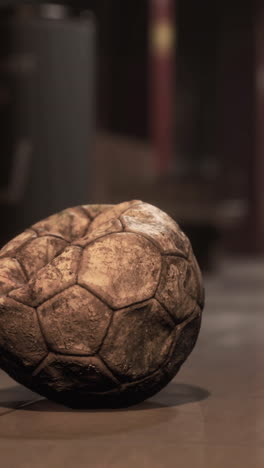 old soccer ball in empty subway