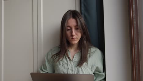 woman working on laptop at home