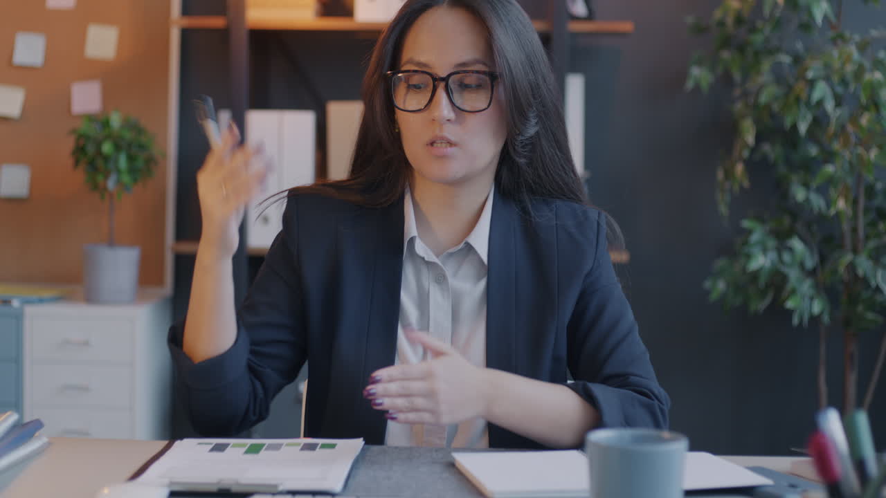 Businesswoman Presenting Data in Office