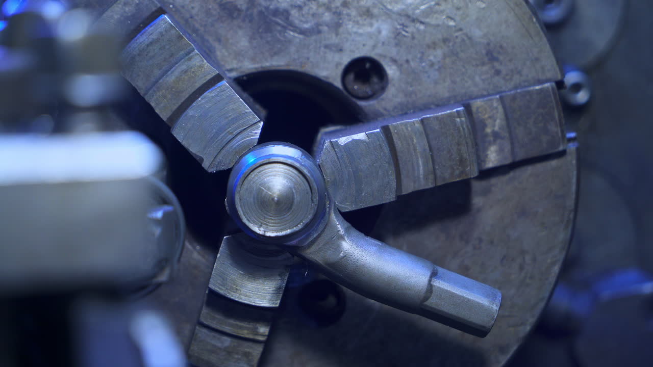 Rotating mechanism in turning lathe to fasten and grind details. Mechanical equipment for turner's workshop. Close up.