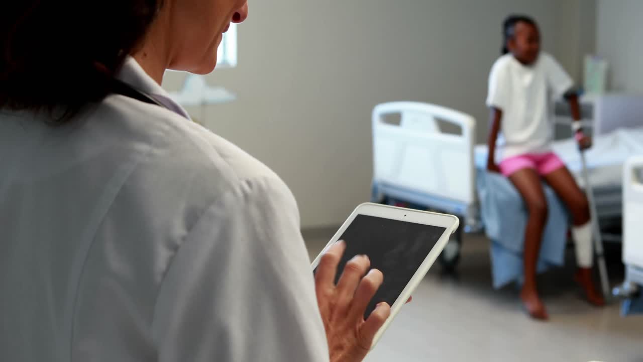 Female doctor using digital tablet