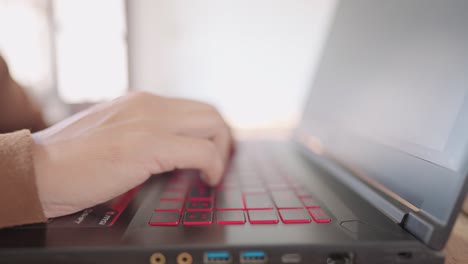 a close-up business man press to type information computer laptop for shopping online at home