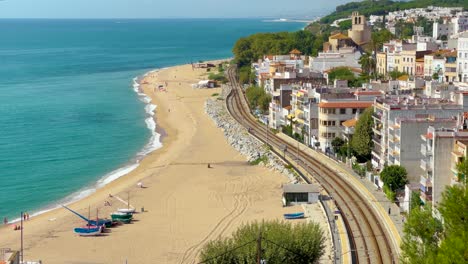 San-Pol-de-Mar-village-view-from-above-beach-train-tracks-white-houses