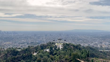 Griffith-Observatory-landmark-skyline,-Downtown-City-of-Los-Angeles,-during-the-day,-cloudy-sky