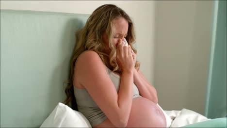 pregnant woman sneezing