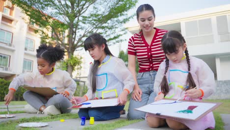 children painting outdoors