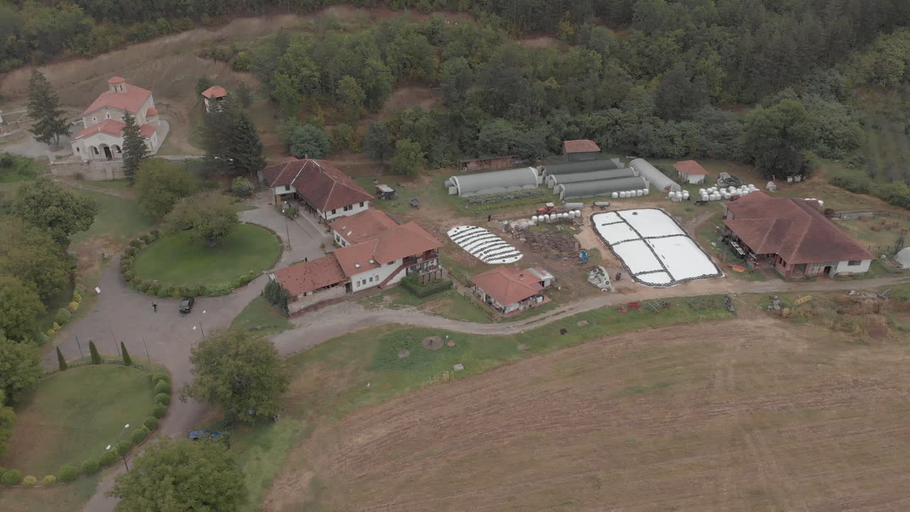 A beautiful Orthodox monastery and a village yard in the mountains from a height