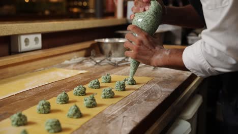 chef preparing spinach ravioli