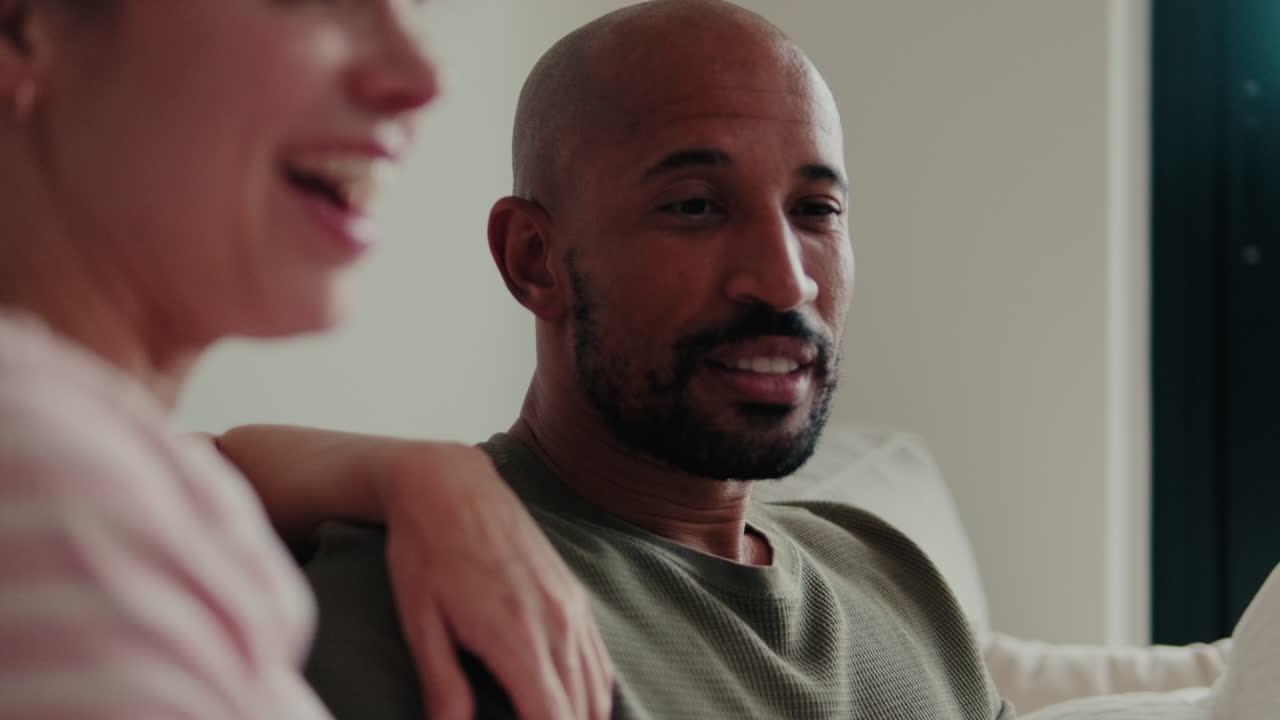 Happy Couple Relaxing Together At Home