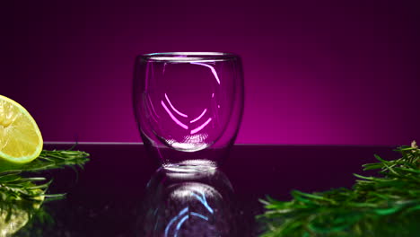 double-walled glass cup with lime and rosemary