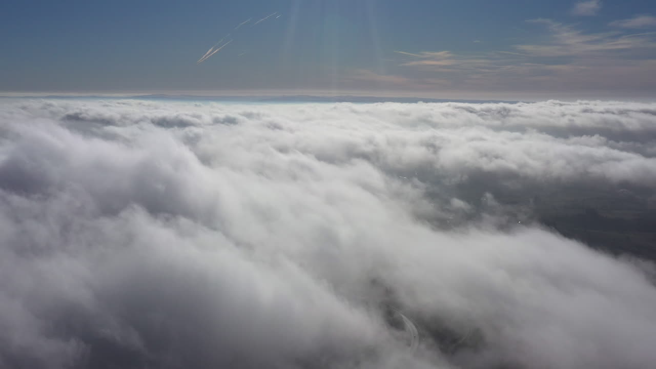 Above clouds moving fast windy day sunny blue sky France