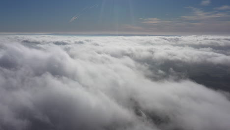 above clouds moving fast windy day sunny blue sky france