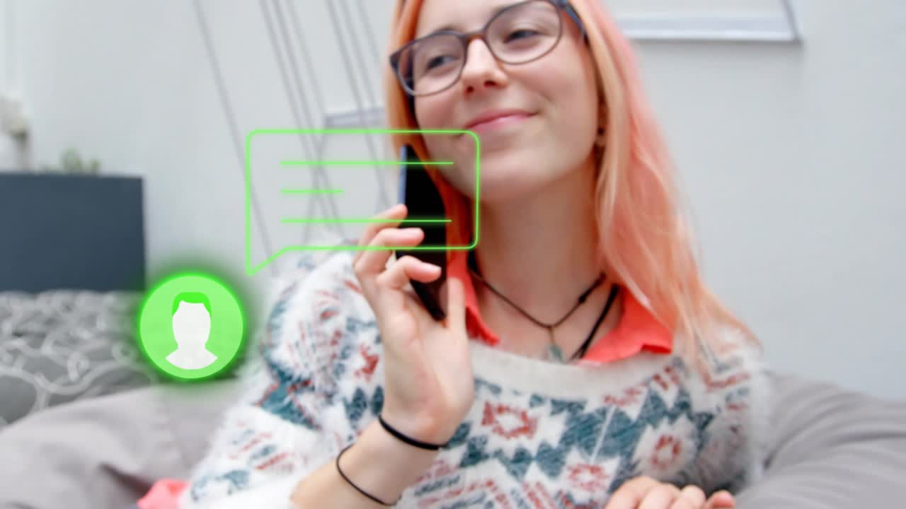 Tech user sofa scrolling smartphone showing green bubbles rotating for viewing call graphic smiling