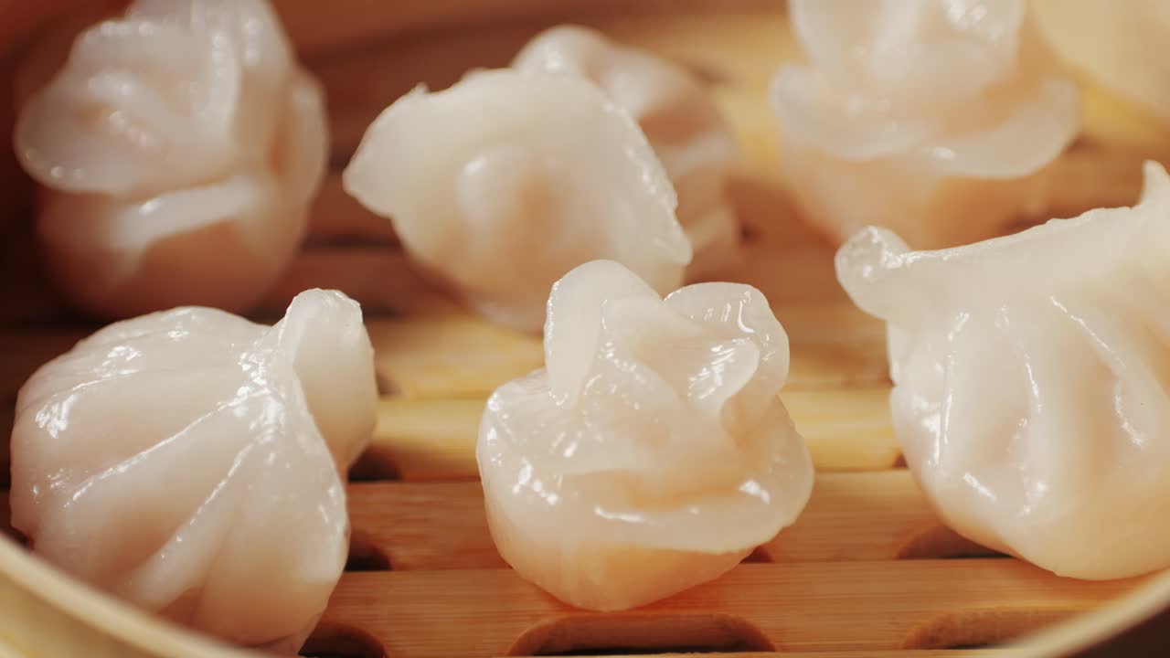 Various of dim sum on wooden steamer close-up macro. Steaming Technique. Chinese dessert food. Dimsum with shrimps, fish and meat. Dish in a cafe. Homade. Delivery