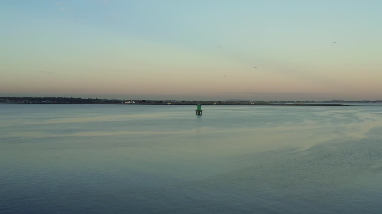 Aerial Dolly in at Green Northbank Light house on the ocean at Dublin, Ireland