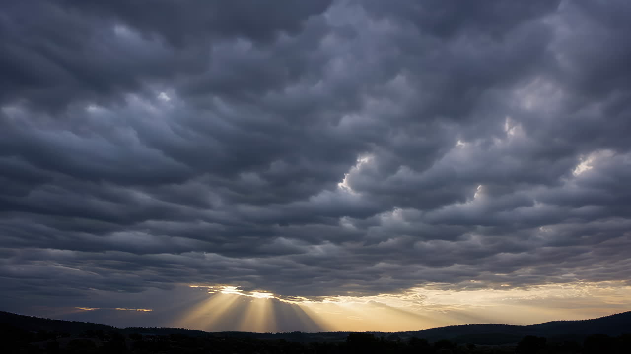 Dramatic Sky with Sun Rays Breaking Through Storm Clouds