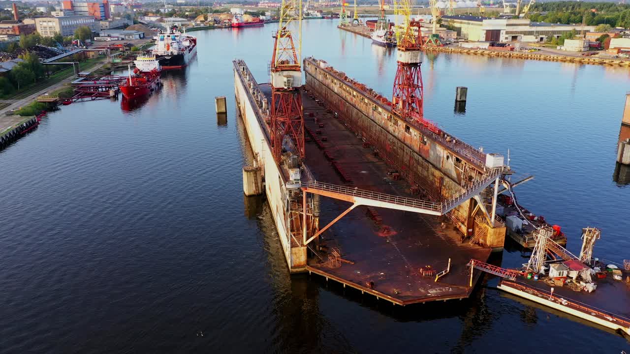 Cinematic aerial over Riga harbor dock illustrating global markets and control