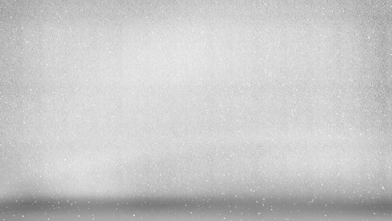 Animation of snow falling over white background at christmas