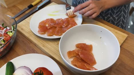 preparing smoked salmon and salad