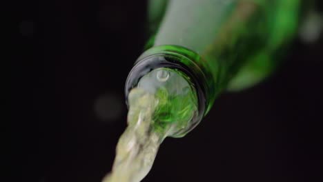 beer flows from a bottle