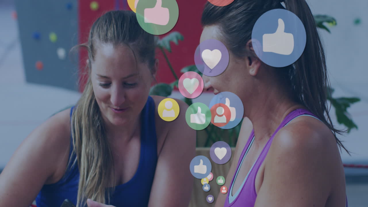 Animation of social media icons over sportswomen with smartphone