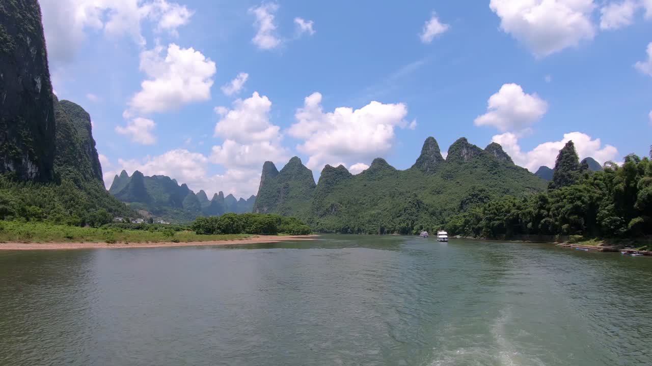 Passenger boats carrying tourists on a journey on the magnificent Li river from Guilin to Yangshuo, China