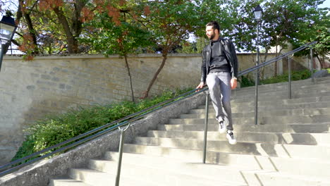 a man slides down ramp pan-shot