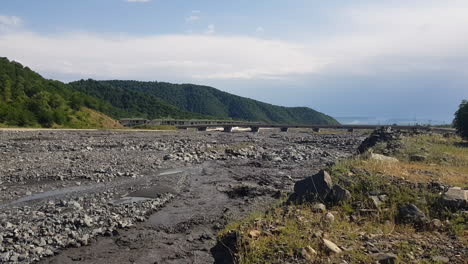 muddy river in pristine countryside landscape of azerbaijan on sunny summer day