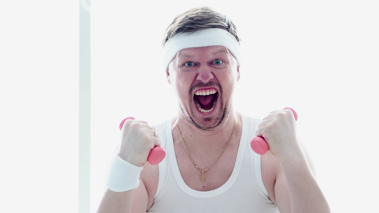 Energetic Man Doing a Comical Dumbbell Workout