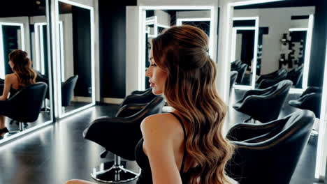woman with wavy hair in a modern hair salon