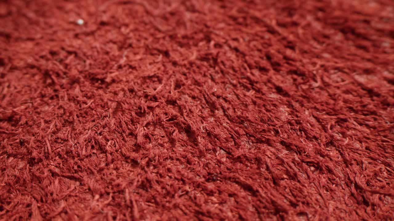 Primo piano di una texture in tessuto rosso